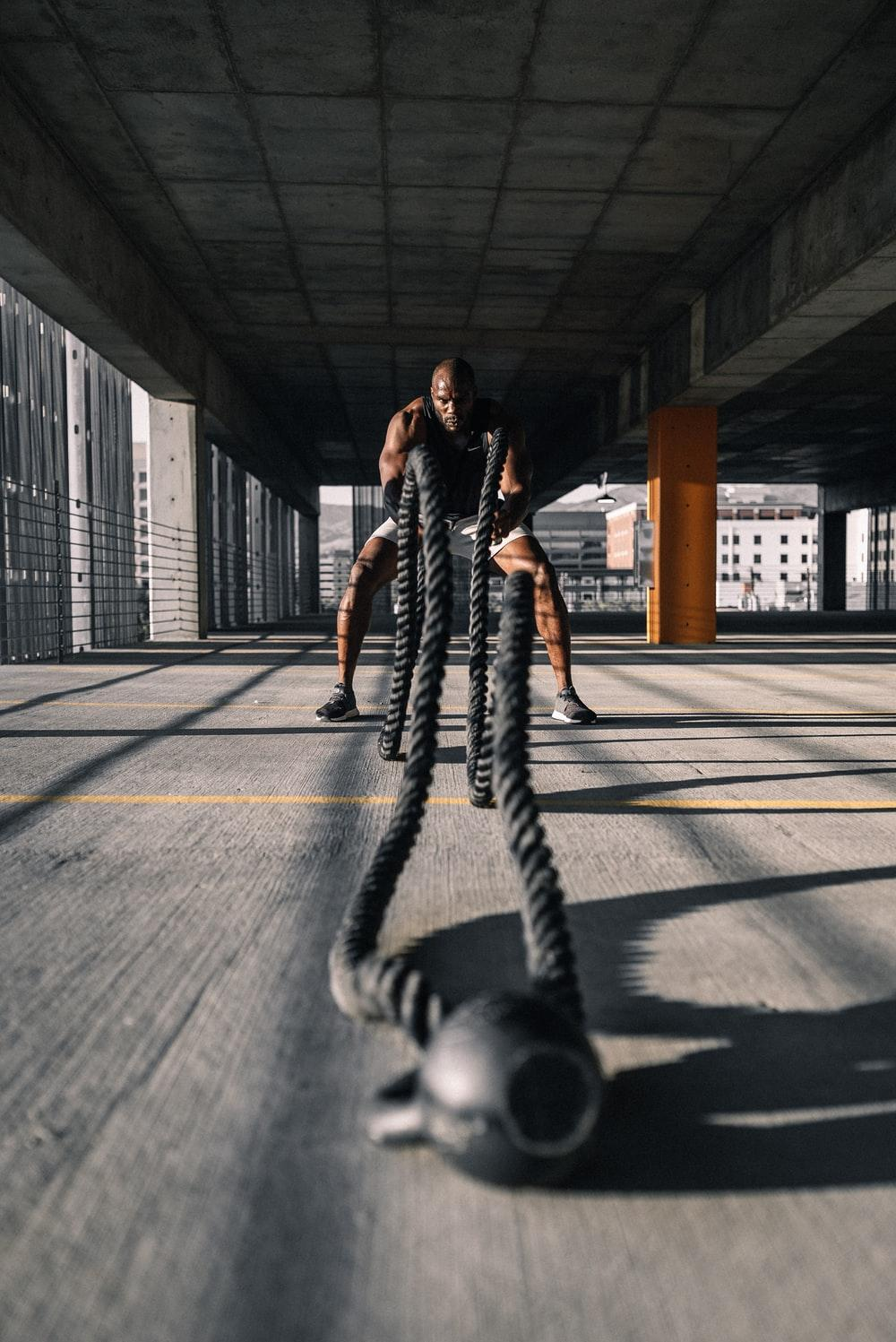 Person engaging in battle rope training